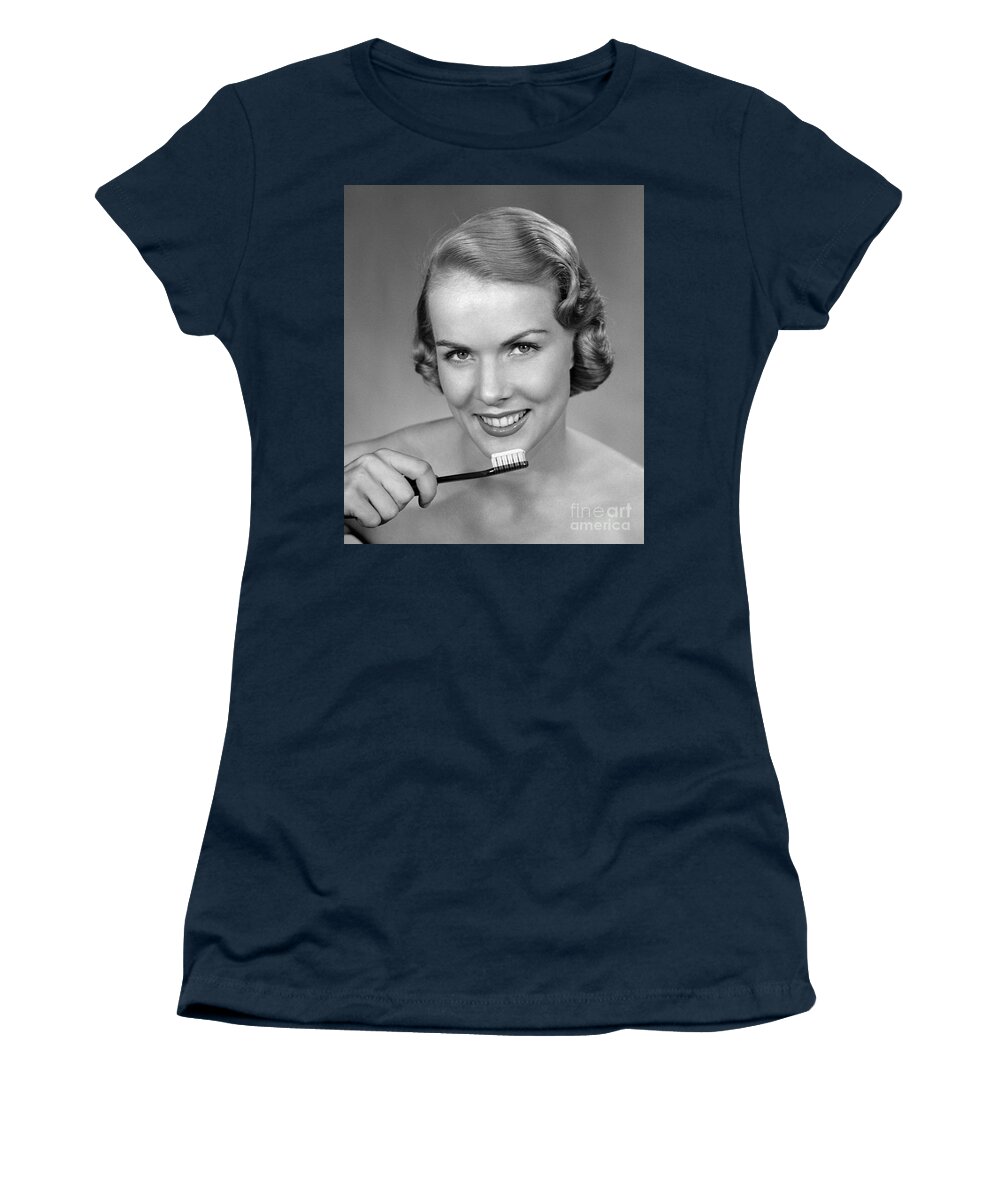 1950s Women's T-Shirt featuring the photograph Smiling Woman Holding Tooth Brush by H Armstrong Roberts ClassicStock