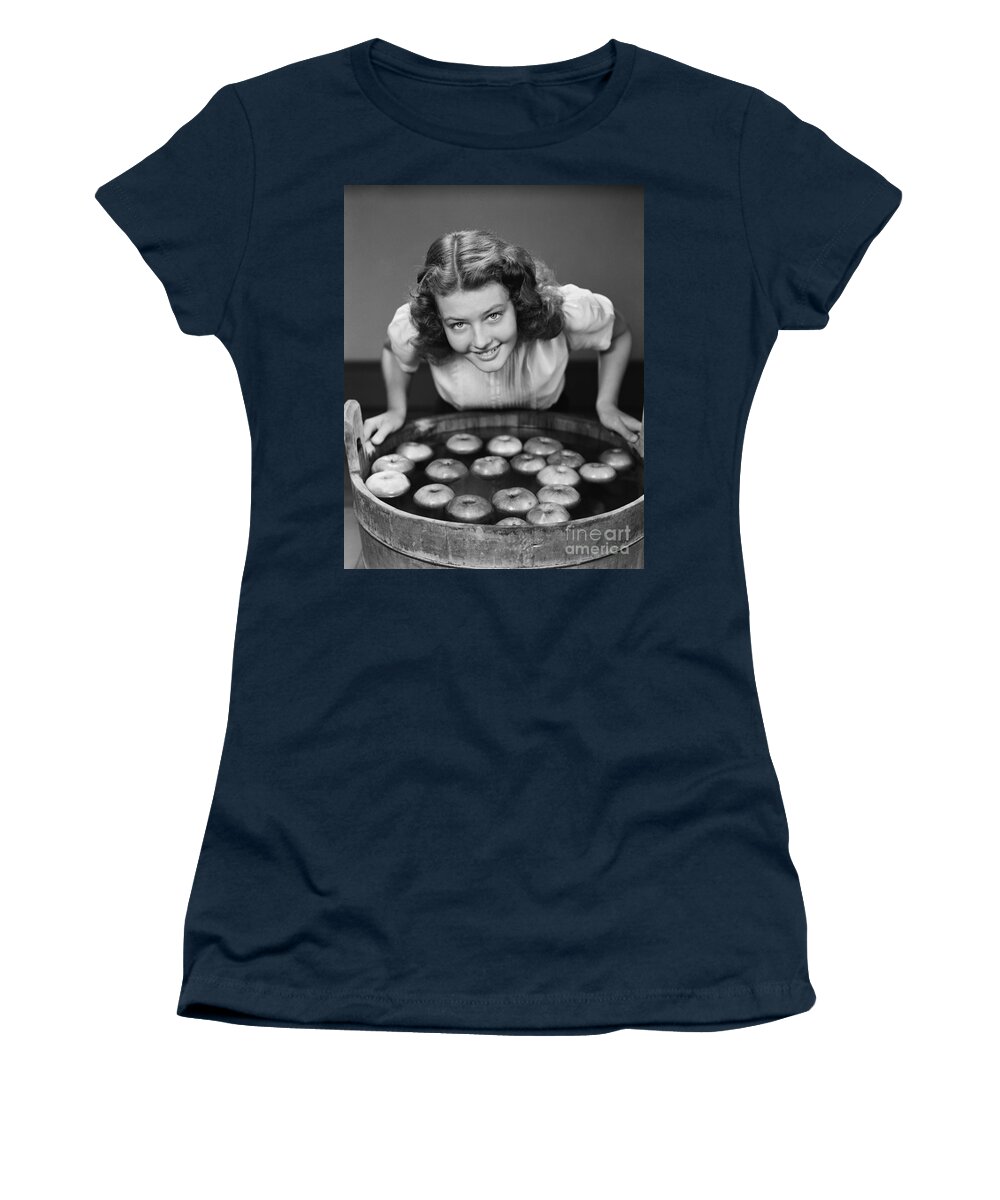1940s Women's T-Shirt featuring the photograph Teen Girl Bobbing For Apples, C.1940s by H. Armstrong Roberts/ClassicStock