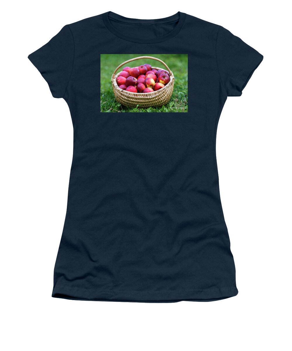 Harvested Women's T-Shirt featuring the photograph Basket with apples in the grass by Ragnar Lothbrok