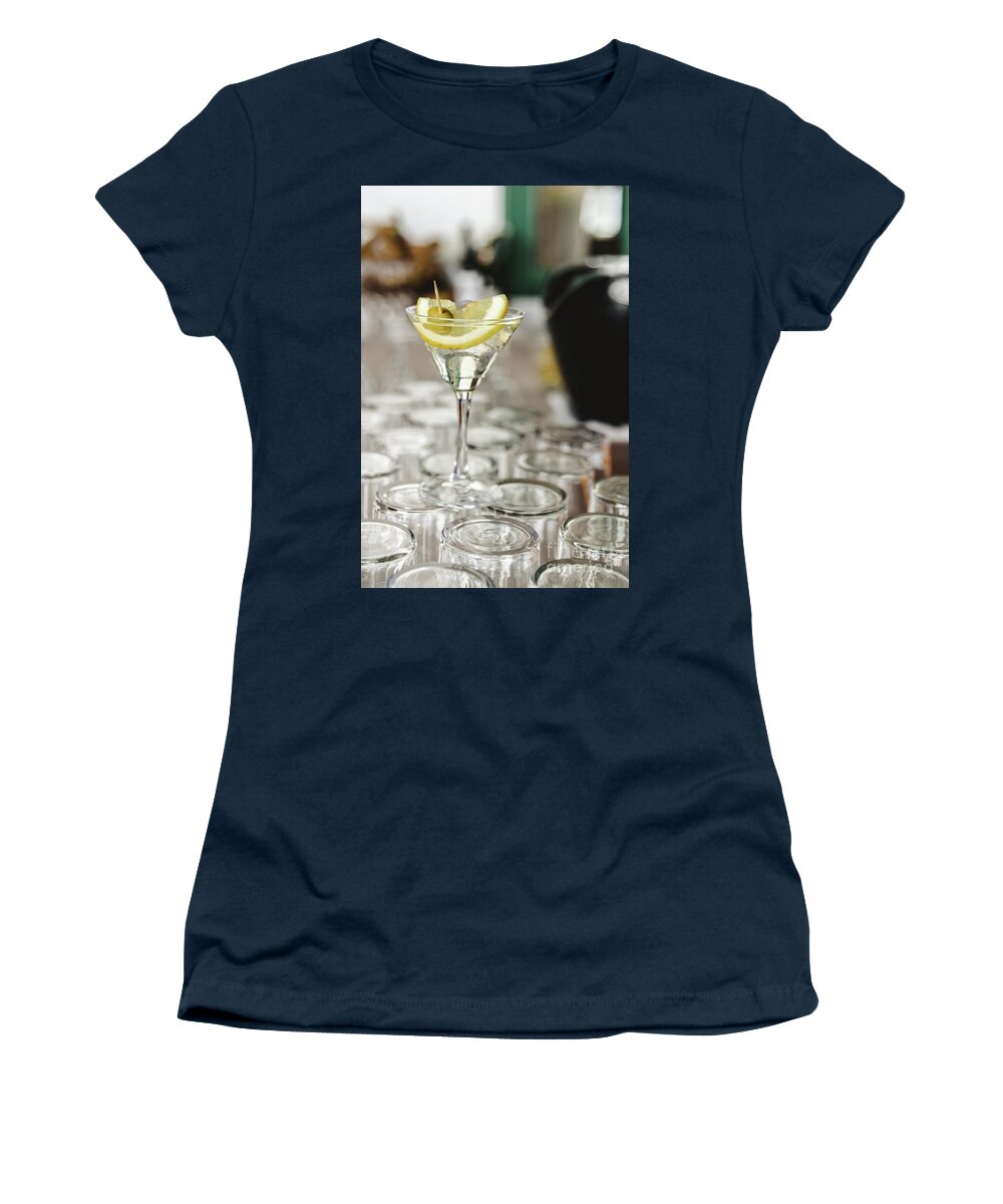 Alcohol Women's T-Shirt featuring the photograph Cup of gin and tonic, with a slice of lemon and olive. by Joaquin Corbalan