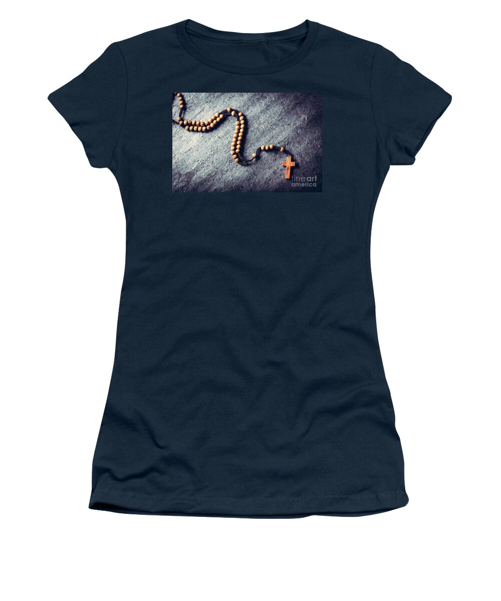 Cross Women's T-Shirt featuring the photograph Wooden rosary laying on stone background. by Michal Bednarek