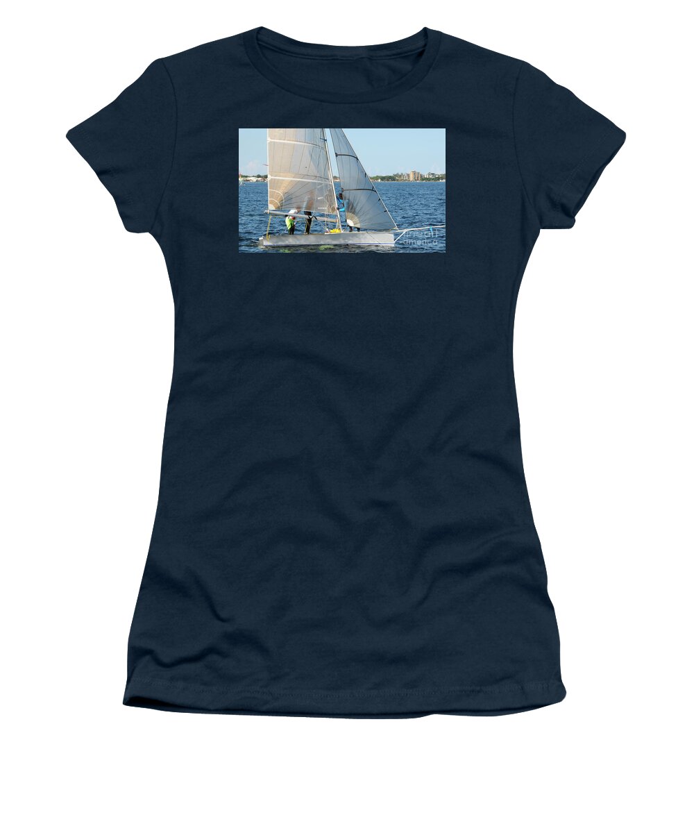 Sky Women's T-Shirt featuring the photograph Children Sailing small dinghy with white sails up-close on an in by Geoff Childs