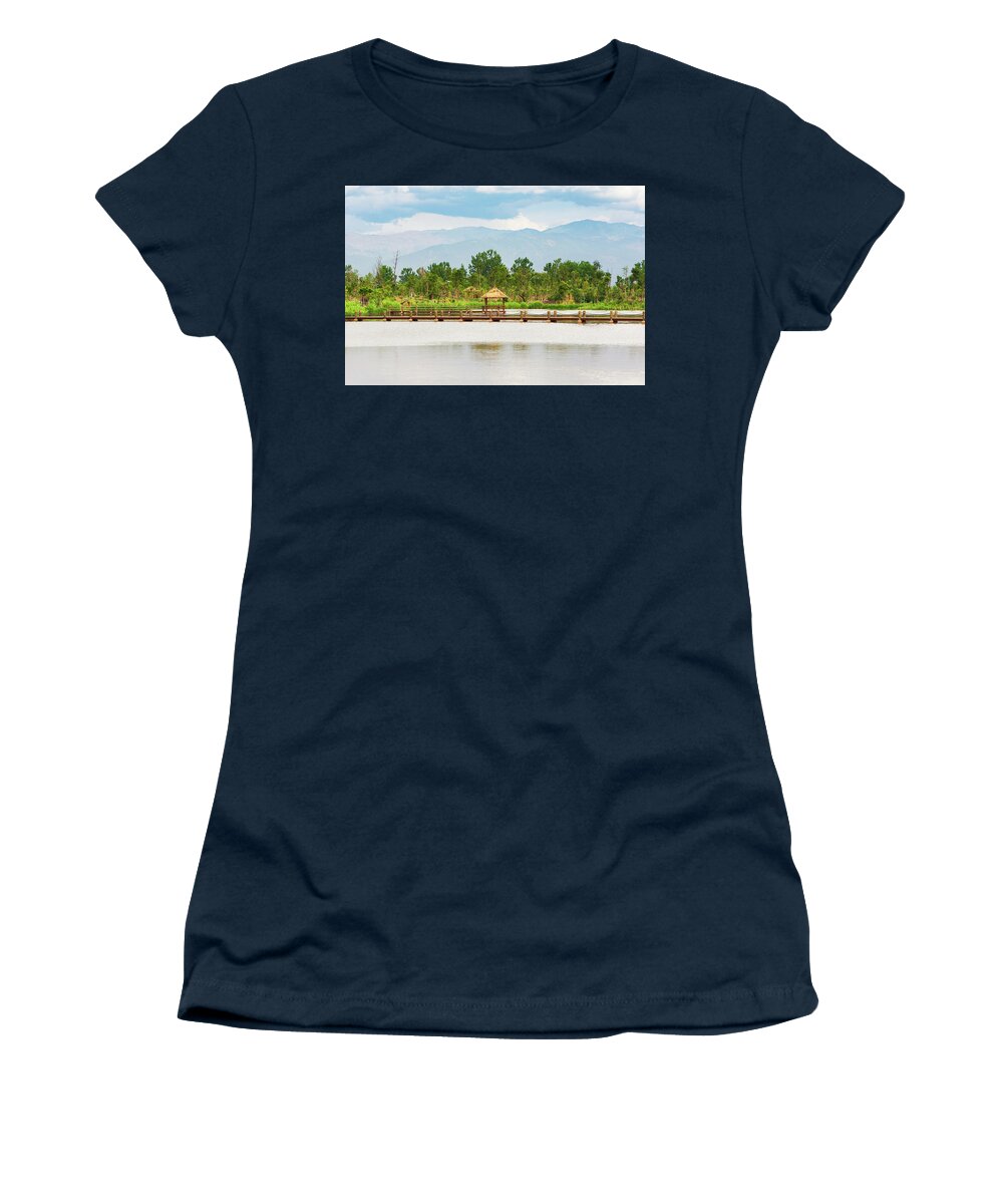 Pavilion Women's T-Shirt featuring the photograph Little wood pavilion on a lake with mountains in the background by Philippe Lejeanvre