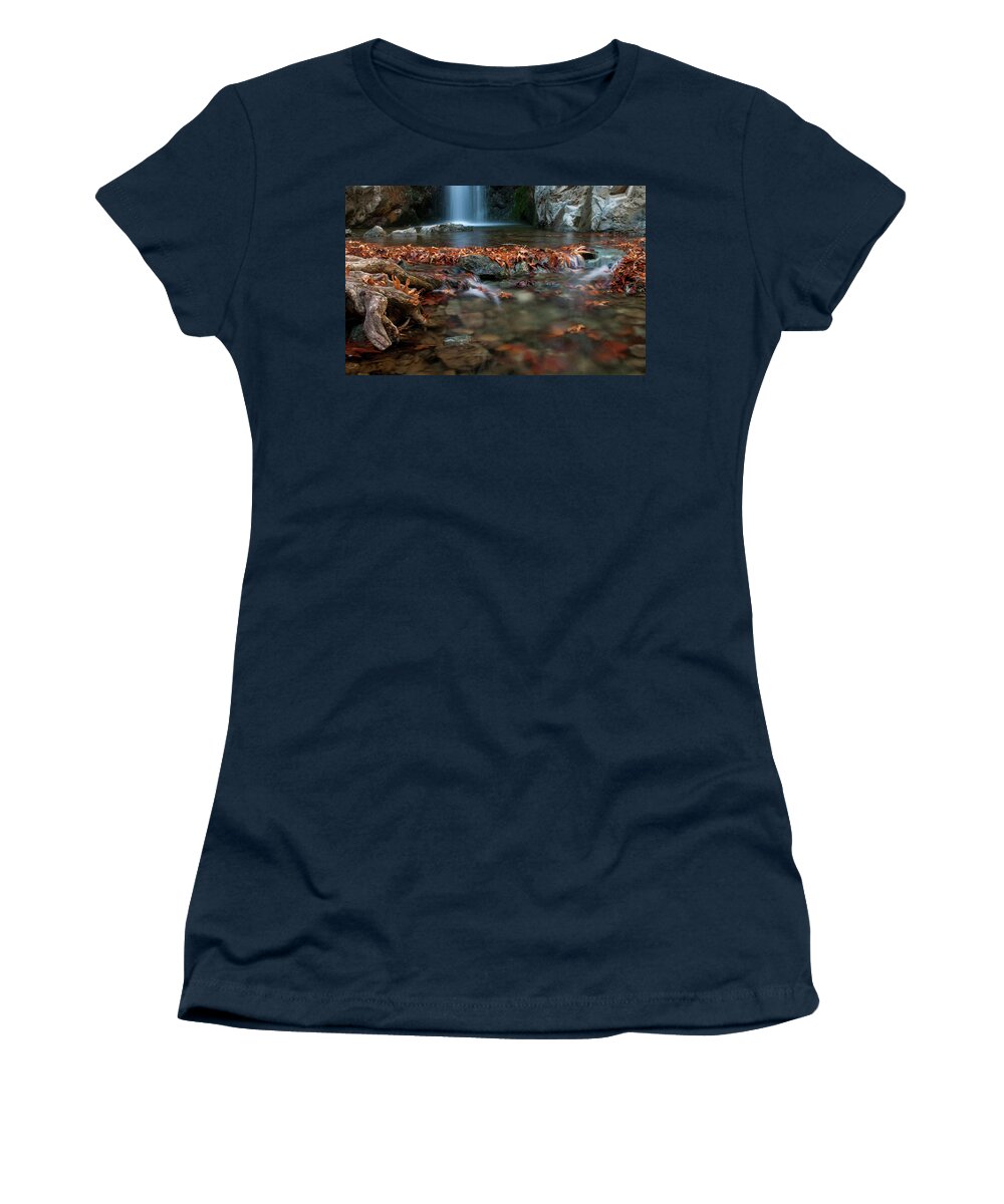 Troodos Women's T-Shirt featuring the photograph Waterfall and river flowing with maple leaves on the rocks on the river in Autumn by Michalakis Ppalis