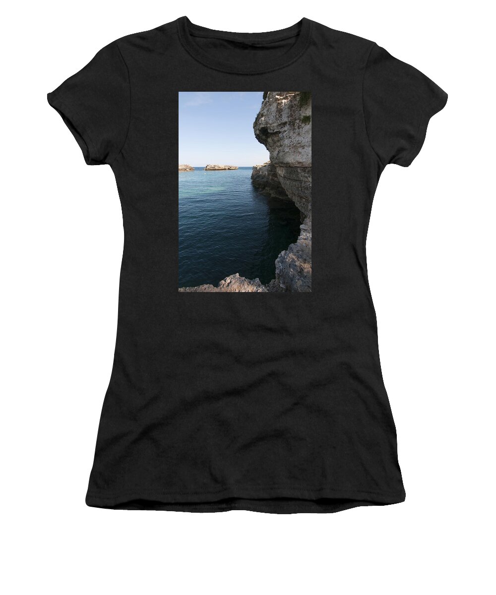 20-24 Women's T-Shirt featuring the photograph Minorca south coast rocks in Alcafar beach rounded with a turquoise mediterranean sea - White rocks by Pedro Cardona Llambias