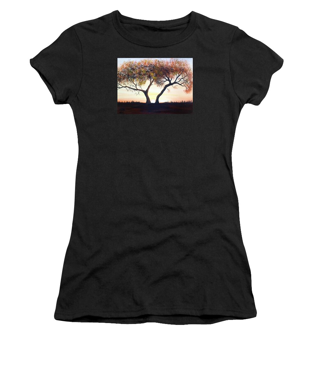 A One Hundred Year Old Tree In The Middle Of A Meadow. The Sun Is Coming Up In A Cloudless Sky With Distance Trees In The Background. The Tree Has Many Dead Branches And The Leaves Are Multiple-colored. Women's T-Shirt featuring the painting The Eli Tree by Martin Schmidt