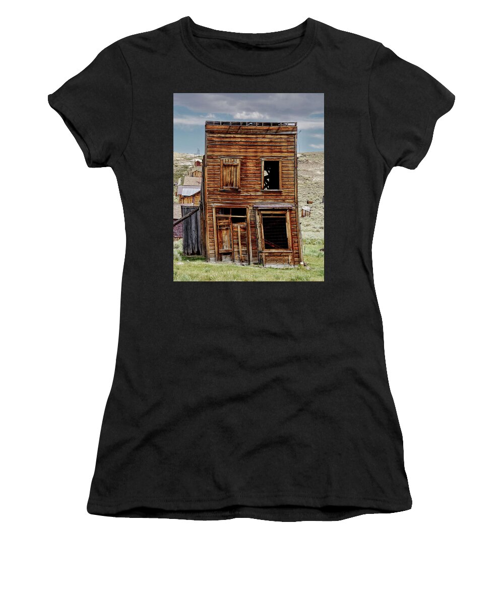 Bodie State Historic Park Women's T-Shirt featuring the photograph Leaning Building Bodie by Brett Harvey