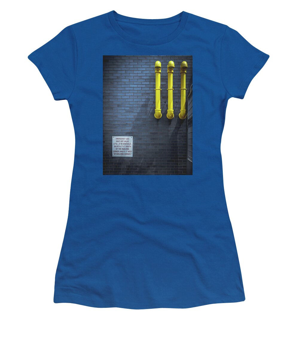 Yellow Pipes Women's T-Shirt featuring the photograph yellow pipes - Queens, NY by Steve Stanger
