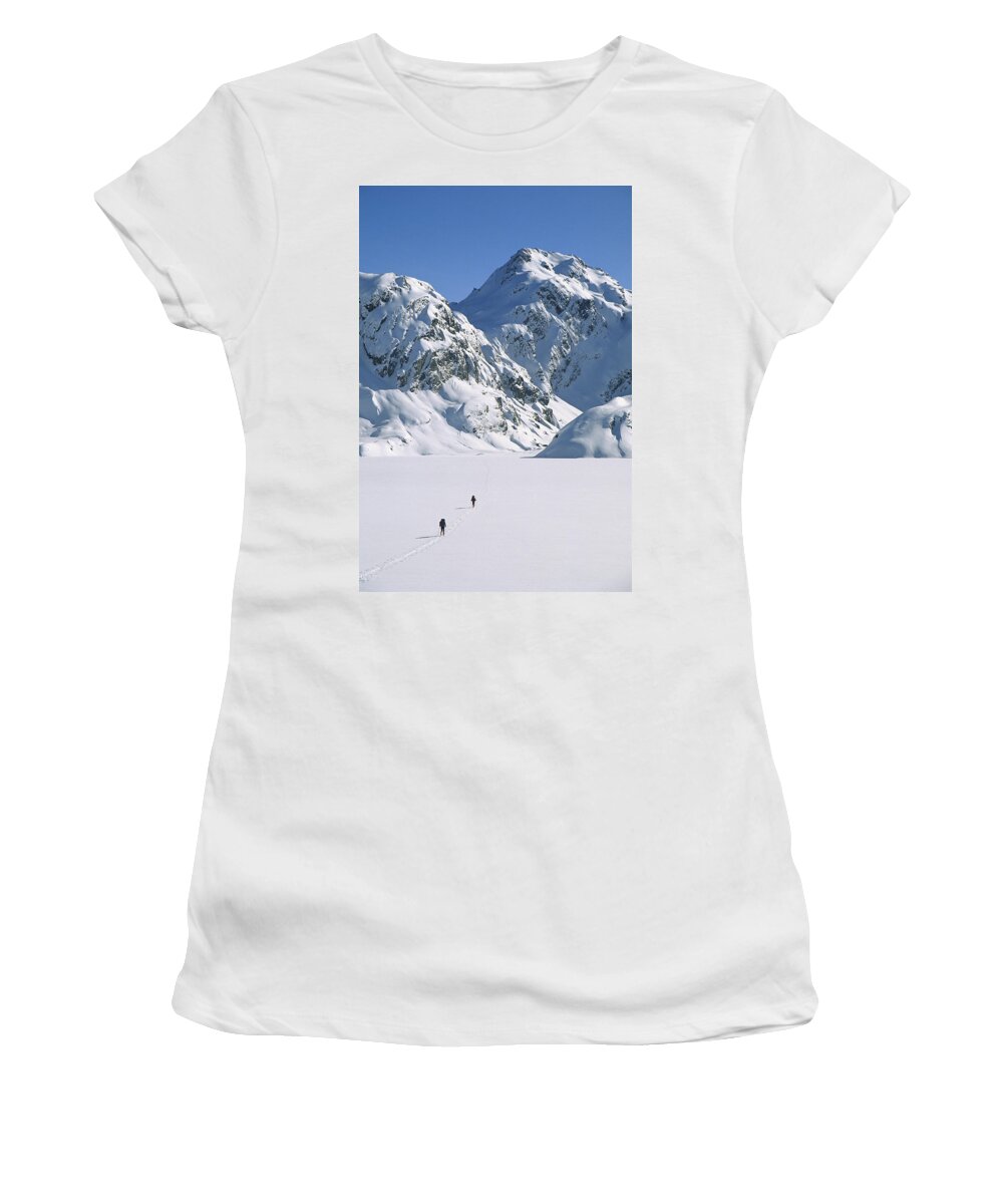 Feb0514 Women's T-Shirt featuring the photograph Skiers Cross Frozen Lake Harris #1 by Colin Monteath