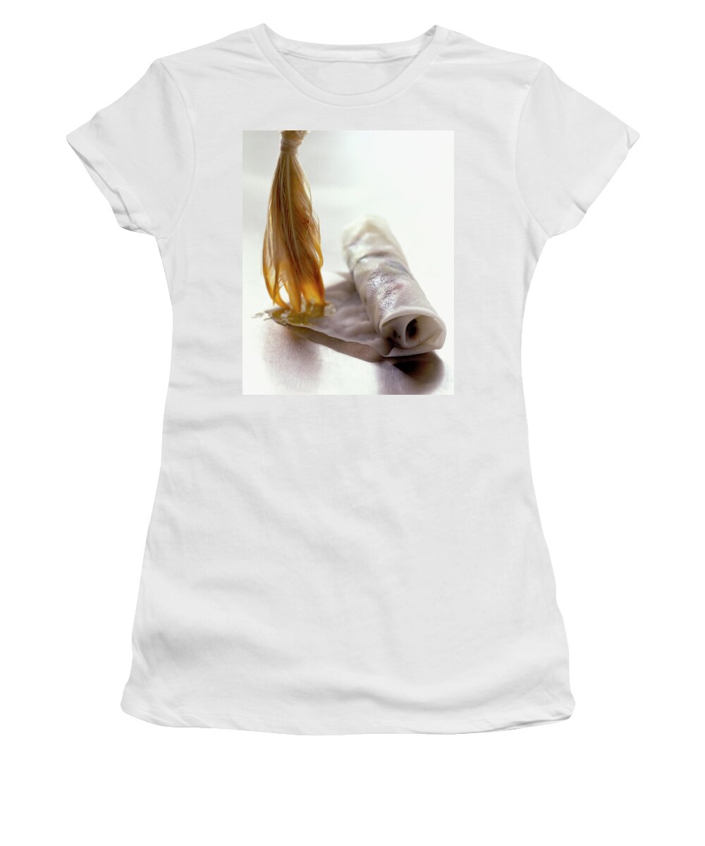 Cooking Women's T-Shirt featuring the photograph An Egg Roll by Romulo Yanes