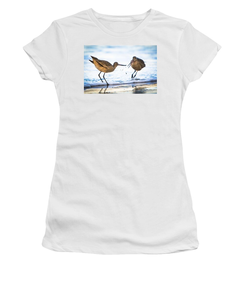 America Women's T-Shirt featuring the photograph Sanderlings Playing at the Beach by John Wadleigh