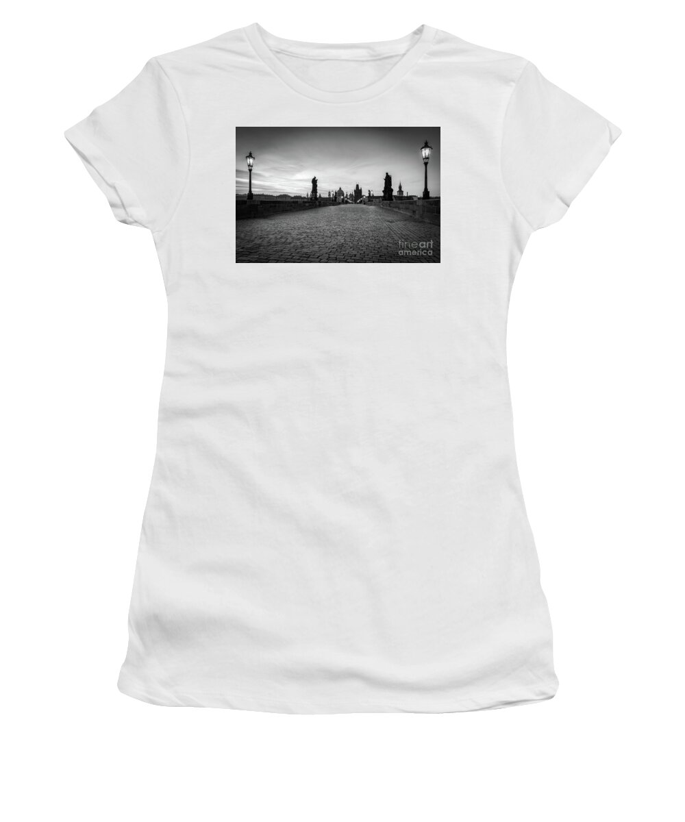 Prague Women's T-Shirt featuring the photograph Charles Bridge at sunrise, Prague, Czech Republic. Statues, medieval towers in black and white #1 by Michal Bednarek