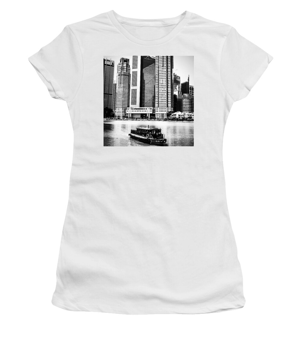 Urban Women's T-Shirt featuring the photograph A Boat Travels Through Singapore by Aleck Cartwright