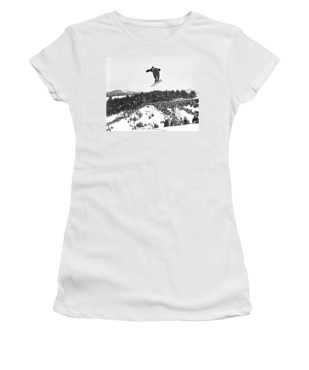 1950's Women's T-Shirt featuring the photograph Dartmouth Carnival Ski Jumper by Underwood Archives