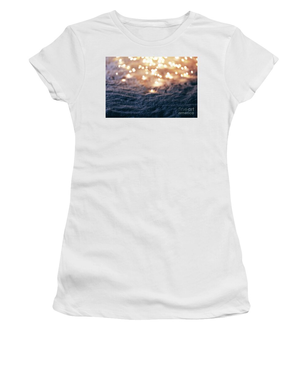 Winter Women's T-Shirt featuring the photograph Snowy winter background with fairy lights. by Michal Bednarek
