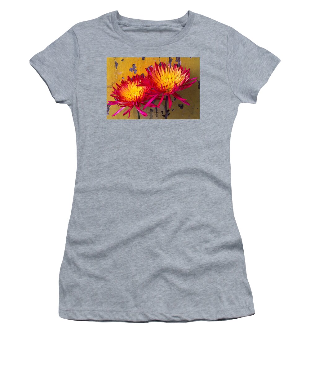 Two Women's T-Shirt featuring the photograph Flame Mums Against Yellow Wall by Garry Gay