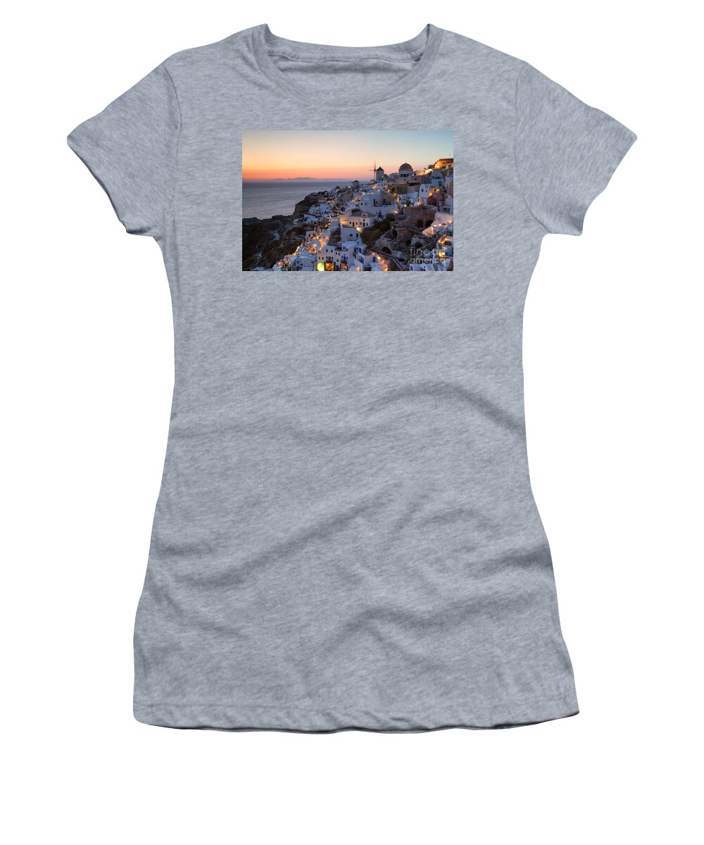 Greece Women's T-Shirt featuring the photograph Romantic sunset over the village of Oia Greece Santorini by Matteo Colombo
