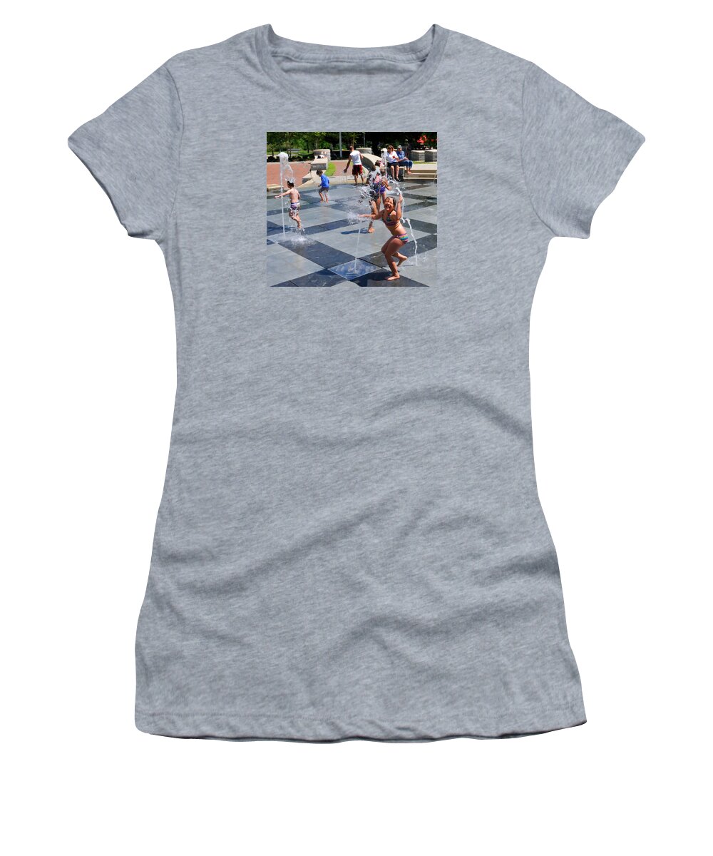 Child Playing In Water Fountain Women's T-Shirt featuring the photograph Joyful Young Girl Playing in Fountain by Ginger Wakem