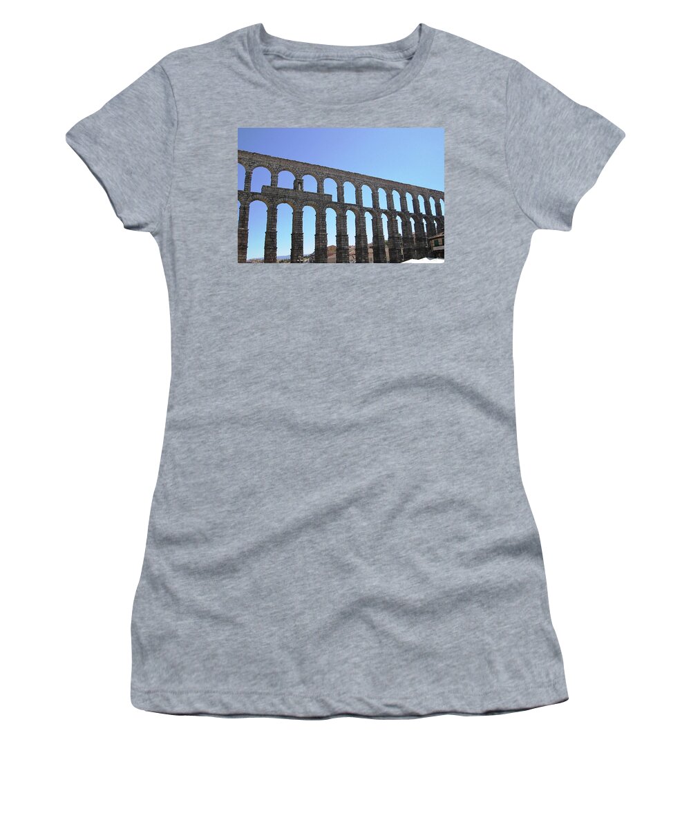 Segovia Women's T-Shirt featuring the photograph Segovia Ancient Roman Aqueduct Architectural Granite Stone Structure IX With Arches in Sky Spain by John Shiron