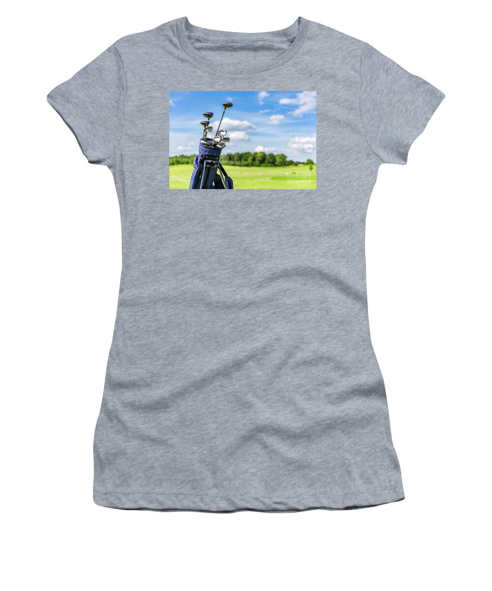 Golf Women's T-Shirt featuring the photograph Golf equipment bag standing on a course. #1 by Michal Bednarek
