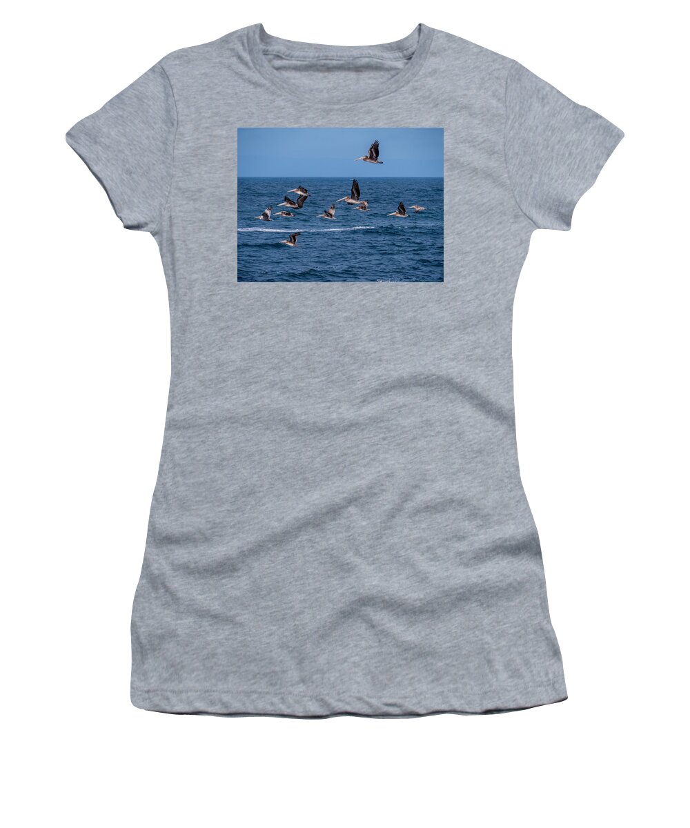 Pelicans Women's T-Shirt featuring the photograph Pelicans Fly Over the Water by Derek Dean