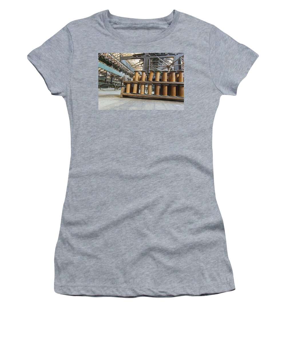 Abandoned Women's T-Shirt featuring the photograph Spools and equipment in factory by Karen Foley