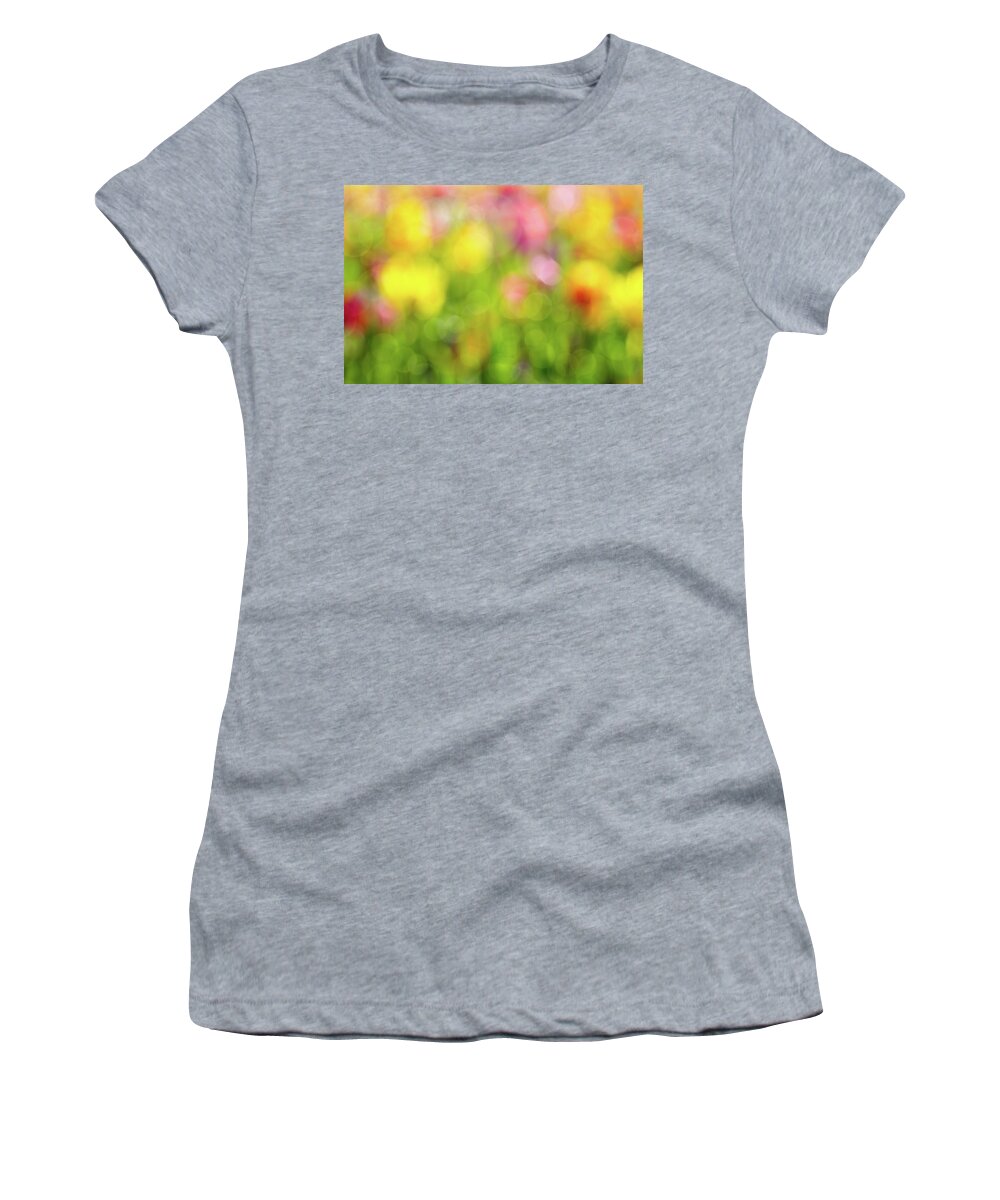 Tulip Women's T-Shirt featuring the photograph Tulip Flowers Field Blurred Defocused Background by David Gn