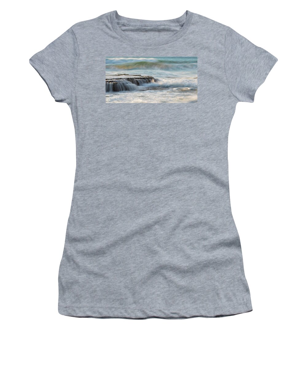 Seascape Women's T-Shirt featuring the photograph Rocky seashore with wavy ocean and waves crashing on the rocks #1 by Michalakis Ppalis