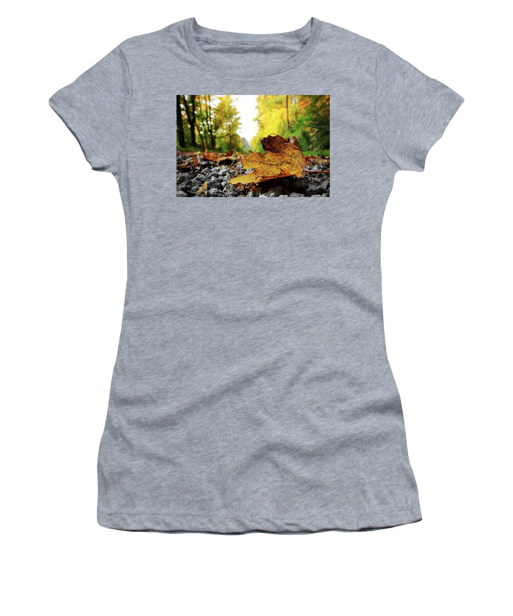 Acer Women's T-Shirt featuring the photograph Black spotted yellow marple leaf on gravel road which surrounded forest, which playing many colors. Pinch of autumn in semptember by Vaclav Sonnek