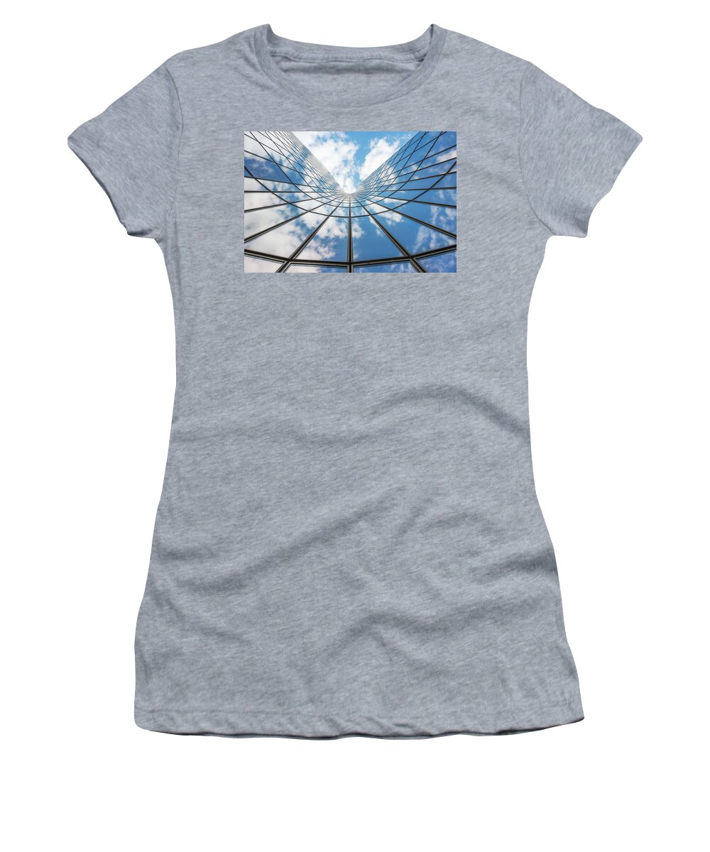 Building Women's T-Shirt featuring the photograph Blue sky and white clouds reflecting in a glass building by Philippe Lejeanvre