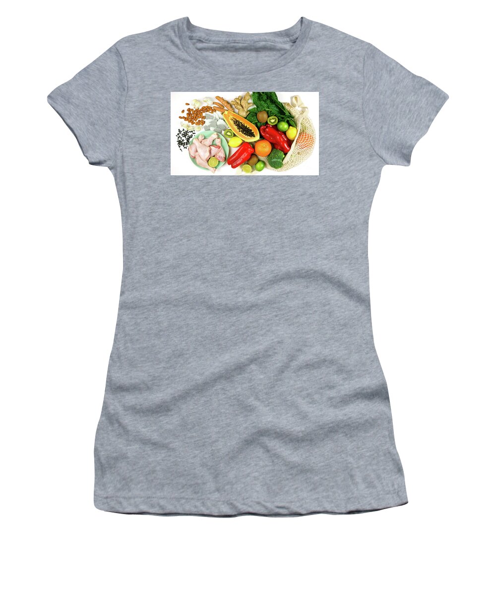 Food Women's T-Shirt featuring the photograph Foods that boost the Immune System including fruit, vegetables and poultry. by Milleflore Images
