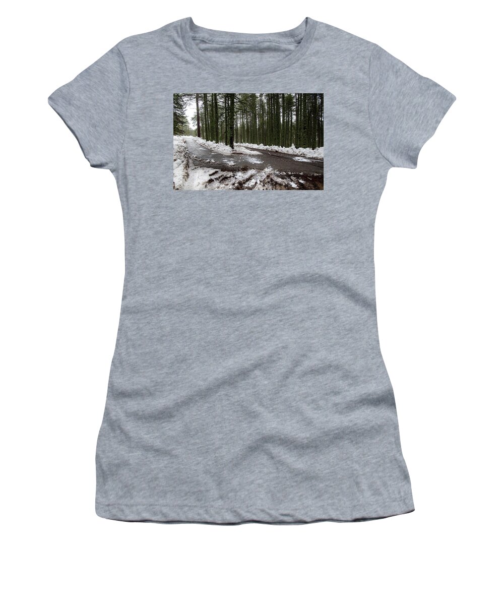 Wintertime Women's T-Shirt featuring the photograph Winter forest landscape with snow on the ground by Michalakis Ppalis