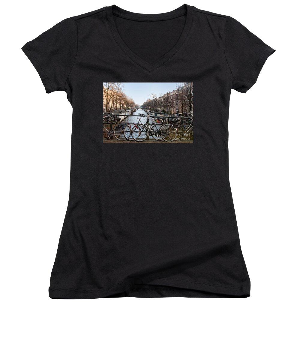 Along The River Women's V-Neck featuring the digital art Bikes on the Canal in Amsterdam by Carol Ailles