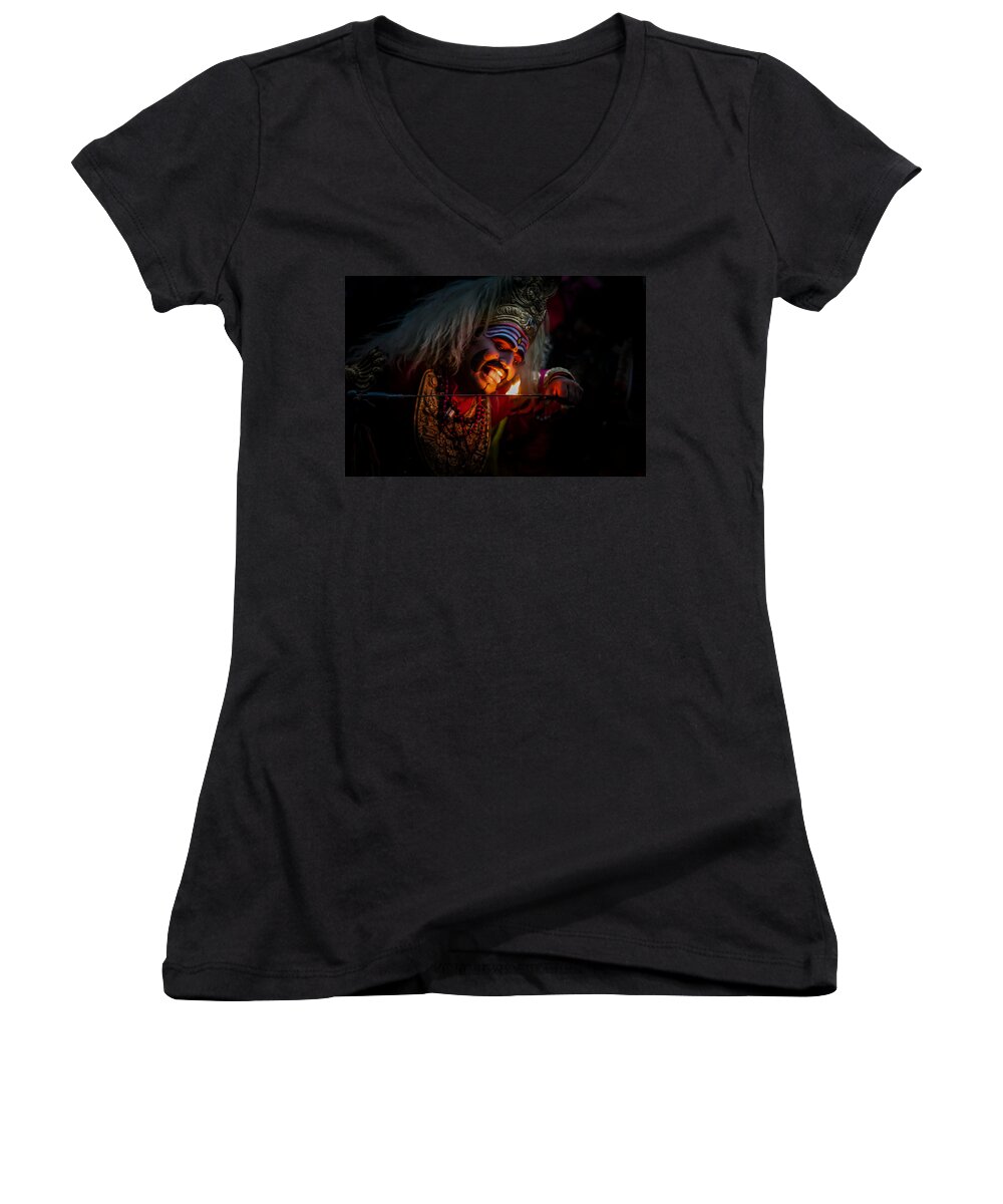 Indianfolk Women's V-Neck featuring the photograph Fearless - Tasting Fire by Ramabhadran Thirupattur