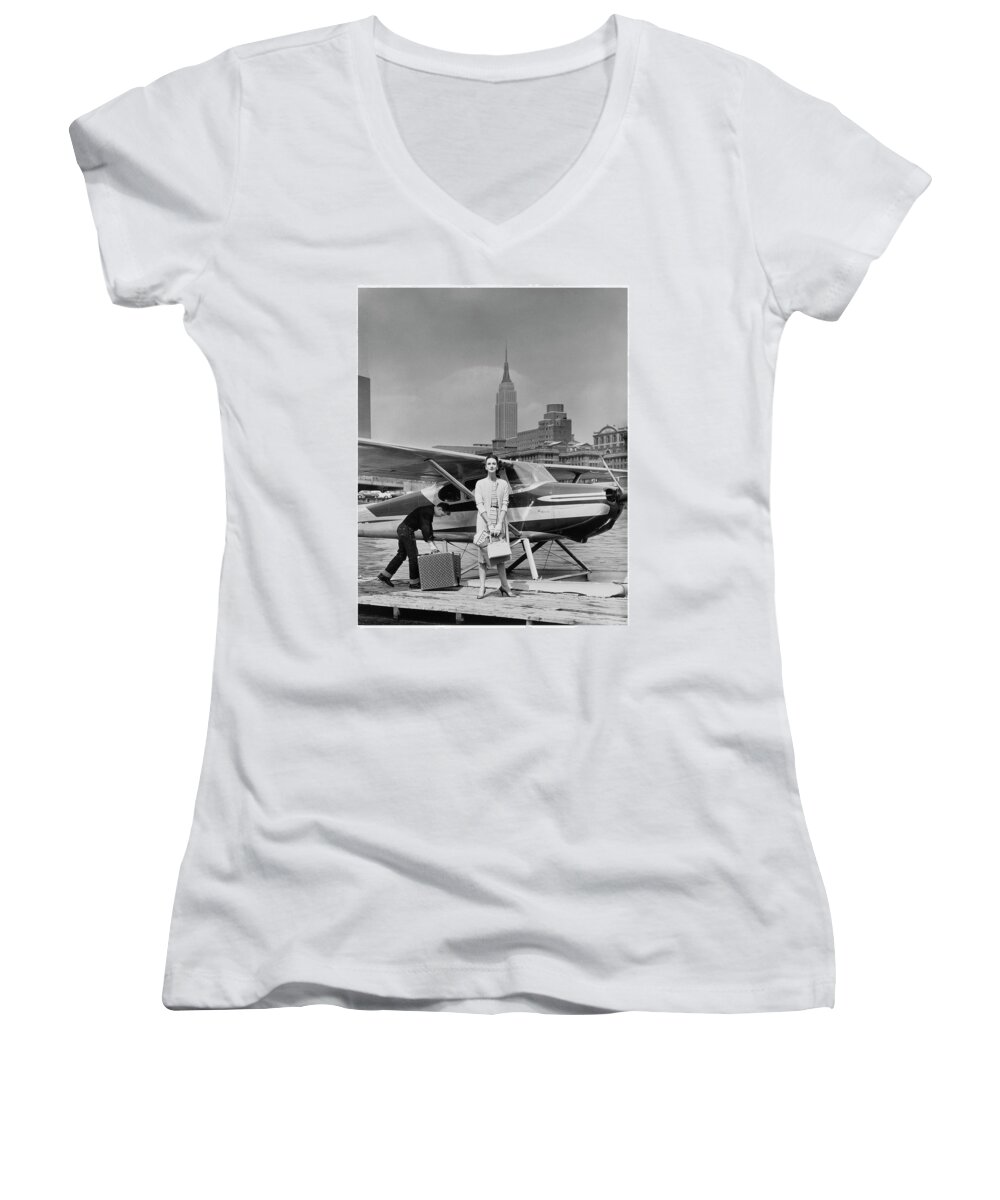 Accessories Women's V-Neck featuring the photograph Woman by a Seaplane by John Rawlings