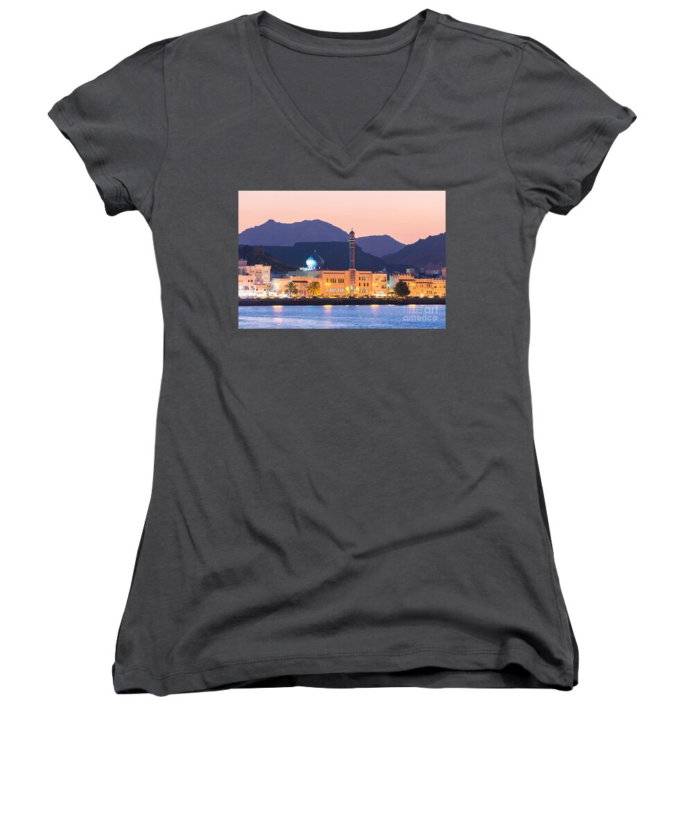 Oman Women's V-Neck featuring the photograph Oman - Muscat - Mutrah harbour and old town at dusk by Matteo Colombo