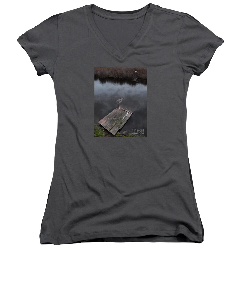  At Twilight A Heron Rests On The Float An Alligator Usually Occupies.clouds Reflect In The Water Of A Baoyu Near The Ocean On Florida's Gulf Coast. Women's V-Neck featuring the photograph Brave Heron by Priscilla Batzell Expressionist Art Studio Gallery