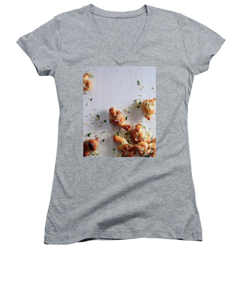 Studio Shot Women's V-Neck featuring the photograph A Group Of Garlic Knots by Romulo Yanes