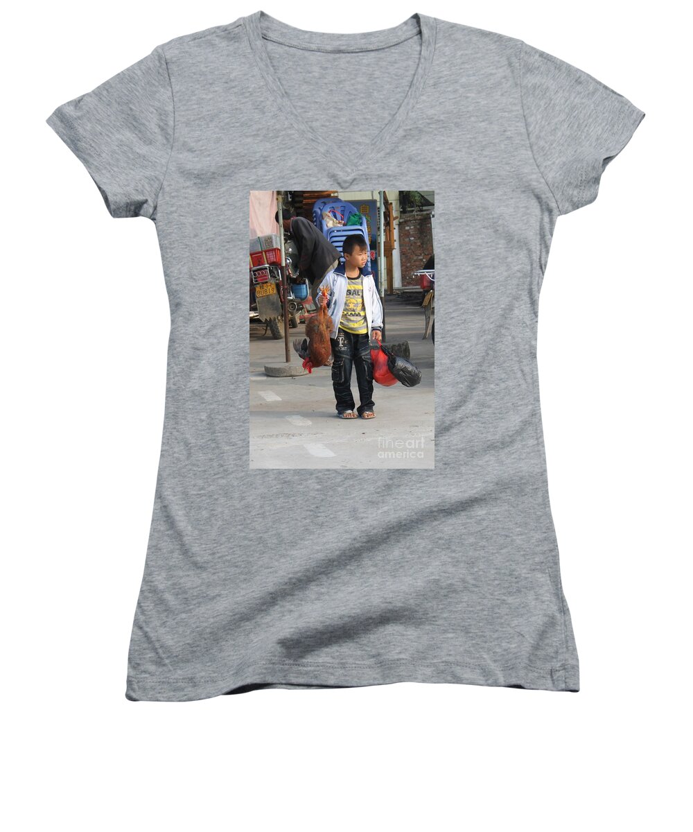 Animal Women's V-Neck featuring the photograph Young boy carrying a dead chicken to school by Thomas Marchessault