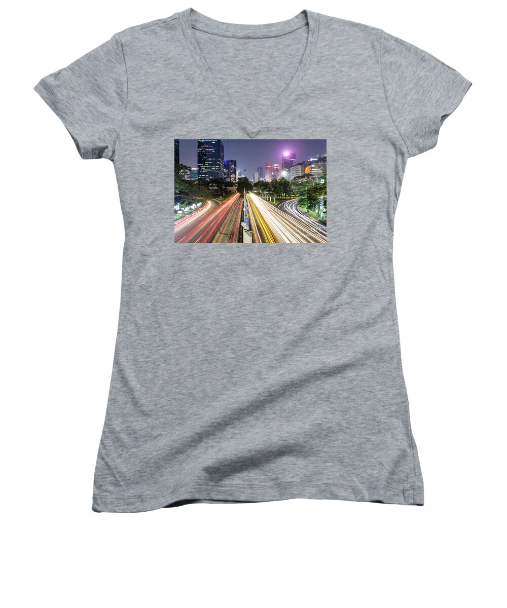 Capital Cities Women's V-Neck featuring the photograph Traffic night rush in Jakarta, Indonesia capital city. by Didier Marti