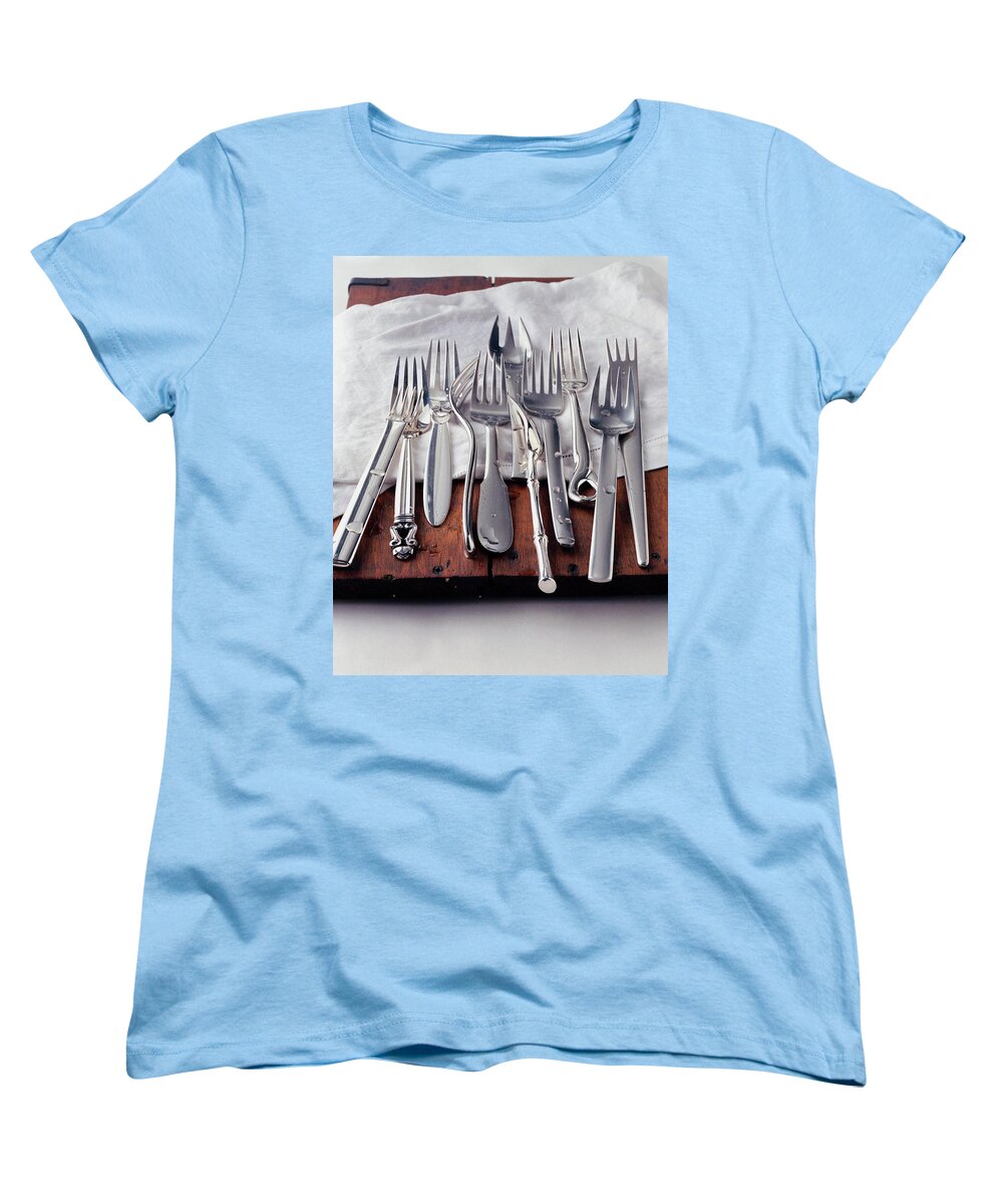 Kitchen Women's T-Shirt (Standard Fit) featuring the photograph Various Forks On A Wooden Board by Romulo Yanes