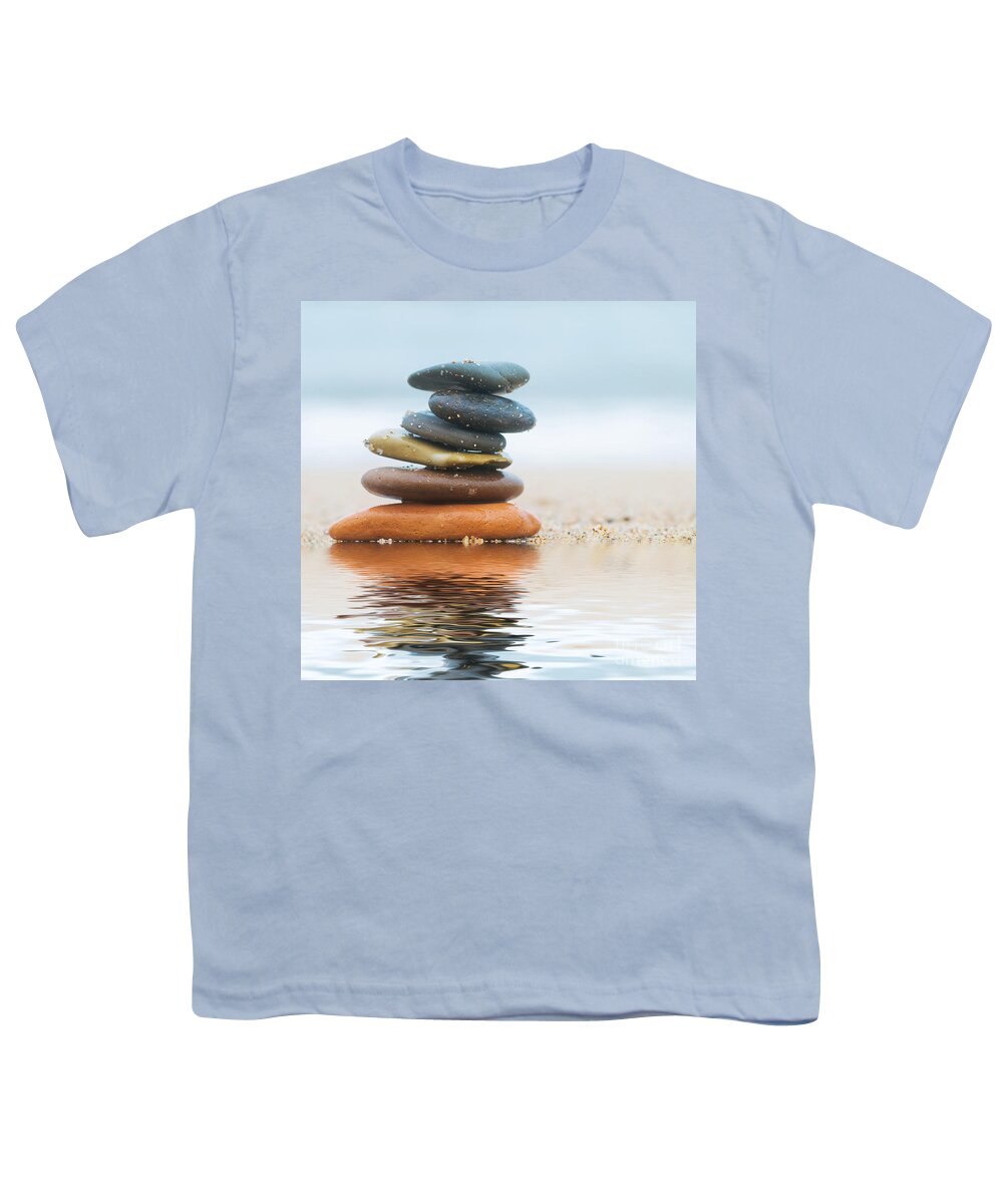 Stone Youth T-Shirt featuring the photograph Stack of beach stones on sand #2 by Michal Bednarek