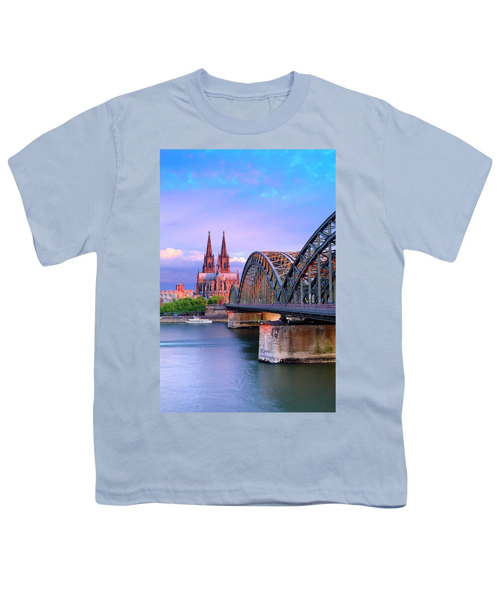 Estock Youth T-Shirt featuring the digital art Germany, North Rhine-westphalia, Cologne, Koln, Rhine, View Over Cologne City Center With Cologne Cathedral And Hohenzollern Bridge Over The Rhine River #1 by Francesco Carovillano