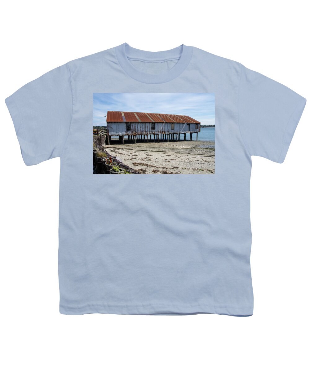 Pilings And Rusty Roof Youth T-Shirt featuring the photograph Pilings and Rusty Roof by Tom Cochran