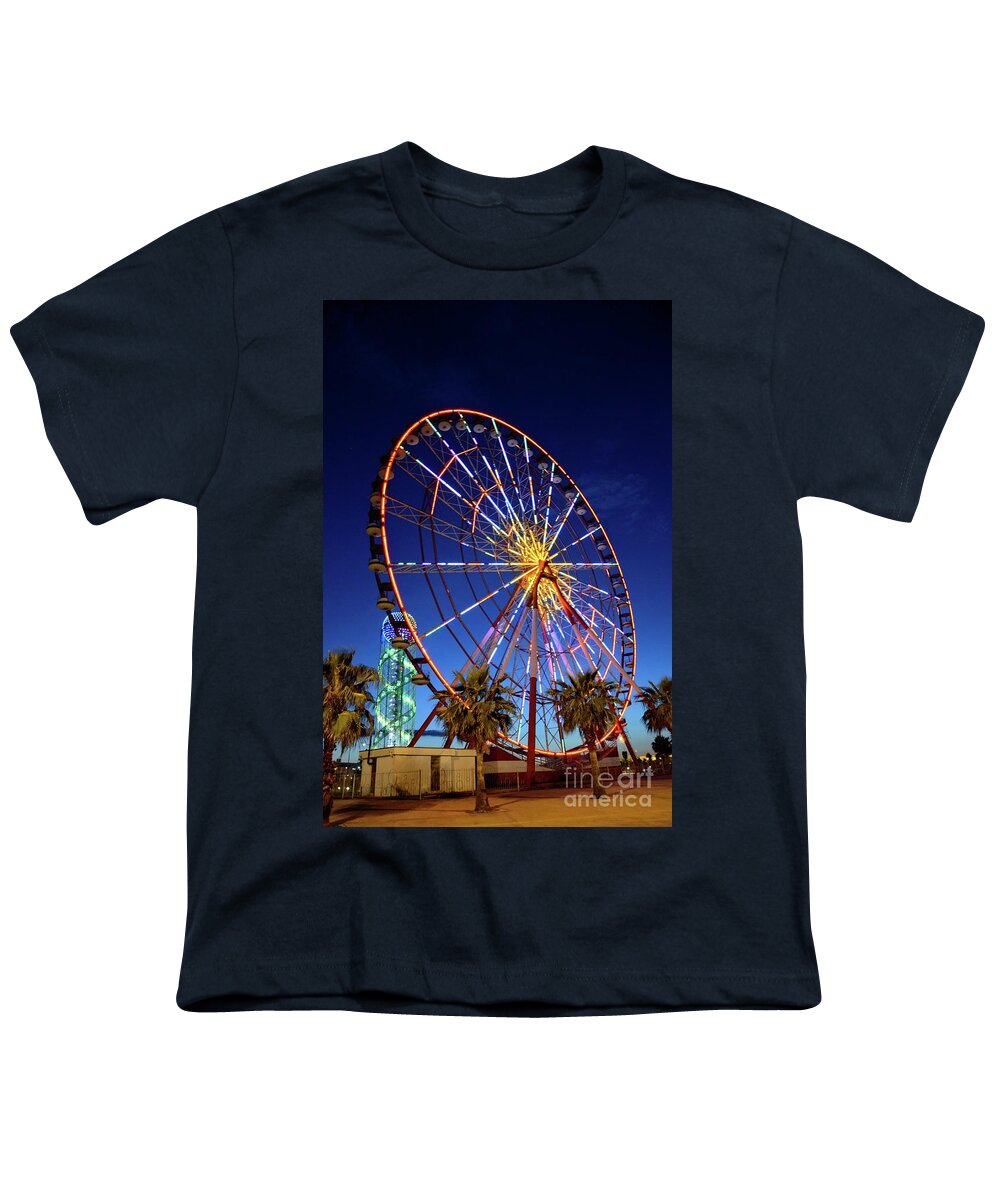 Night Youth T-Shirt featuring the photograph Brightly lit ferris wheel and Alphabet Tower at night in amusement park area Batumi Georgia by Imran Ahmed