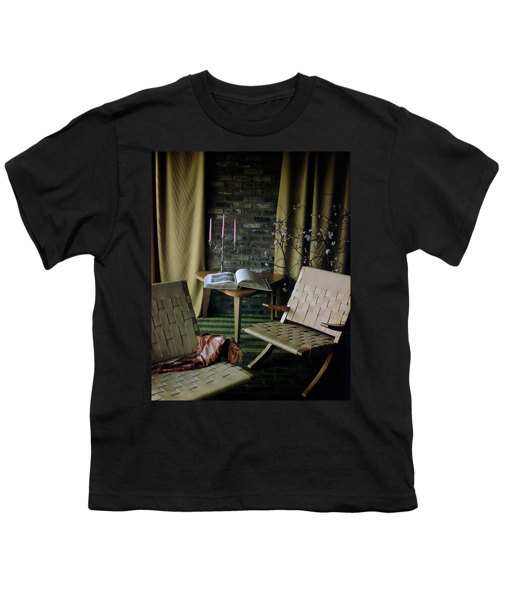 Nobody Youth T-Shirt featuring the photograph An Armchair Beside A Table And An Old Book by Horst P. Horst