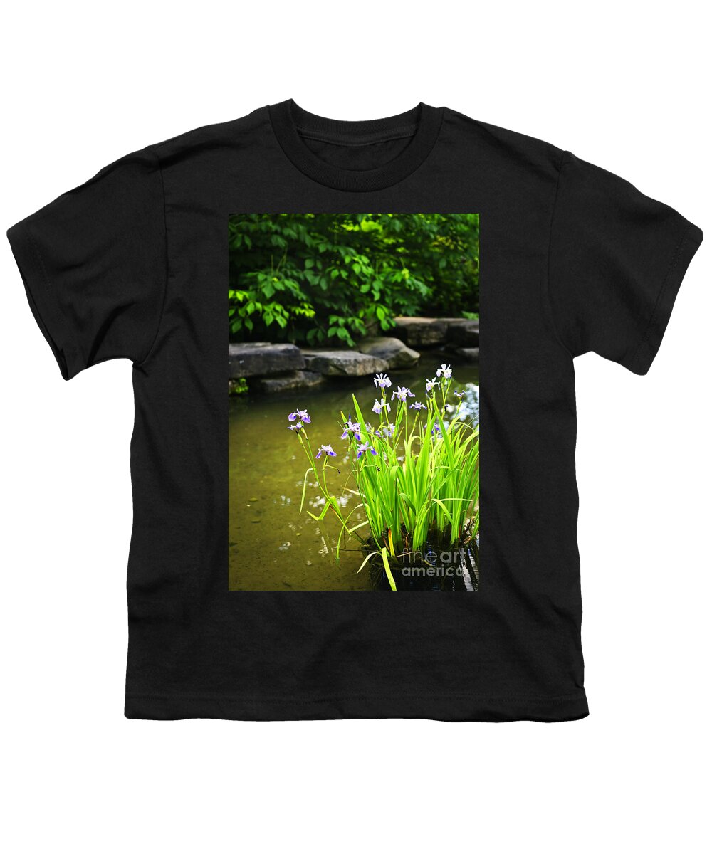 Garden Youth T-Shirt featuring the photograph Purple irises in pond by Elena Elisseeva
