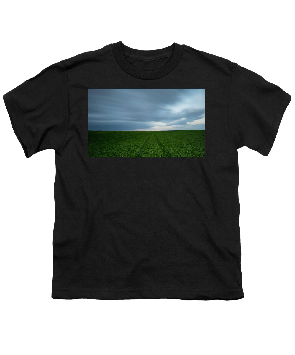Freedom Youth T-Shirt featuring the photograph Green field and cloudy sky by Michalakis Ppalis