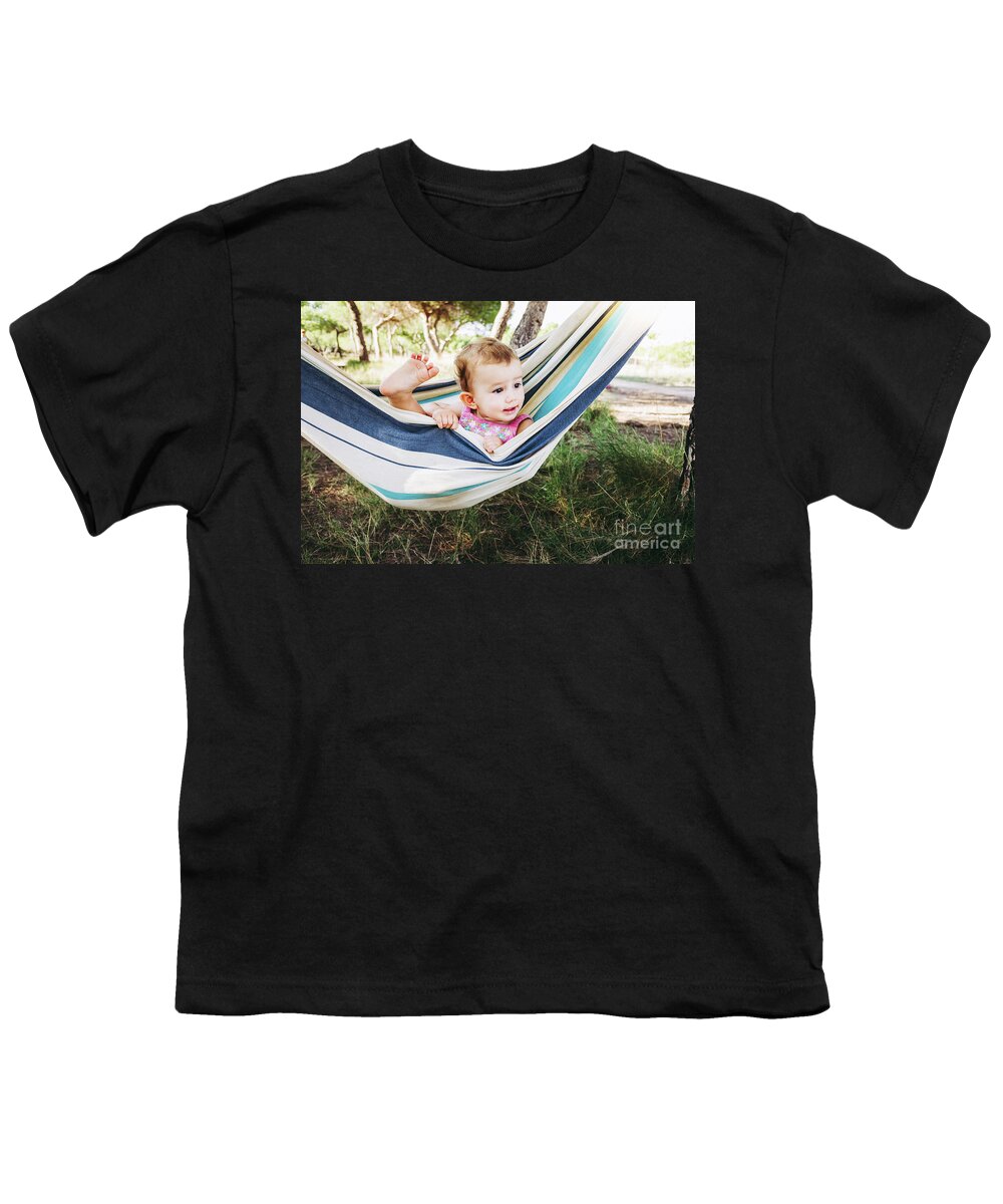 Adorable Youth T-Shirt featuring the photograph Adorable one year old girl inside a hammock smiling and having f by Joaquin Corbalan
