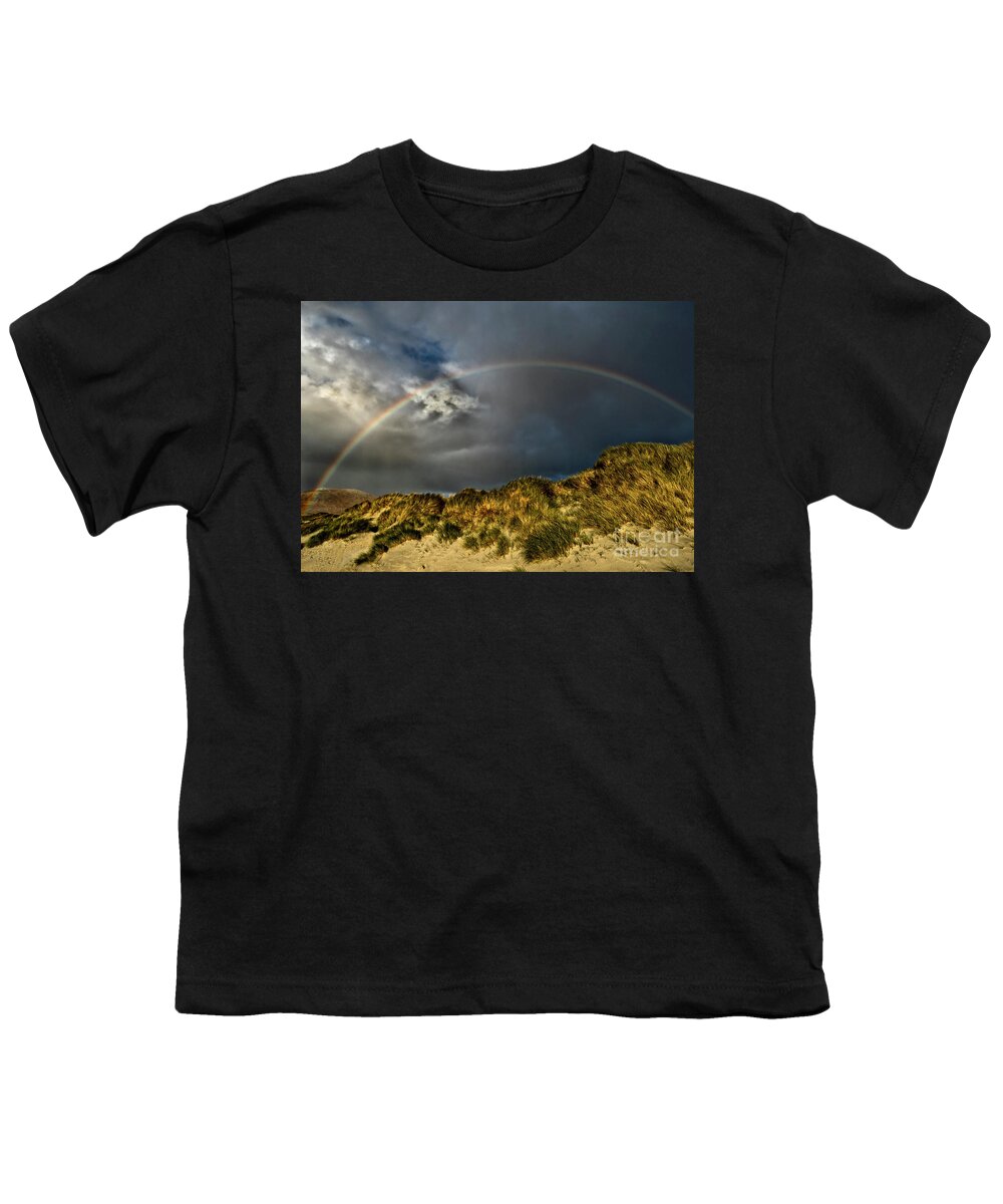 Dramatic Beauty Rainbow Sand Dunes Clouds Grass Landscape Wonderland Panoramic Beautiful West Highlands Elements Sun Rays Atmospheric Dawn Dusk Heavy Powerful Attractive Sky Stunning Delightful Magnificent Singular Transient Spectacular Glory Breath-taking Painterly Vivid Bright Vibrant Golden Autumn Colorful Yellow Artistic Inspirational Serene Tranquil Stylish Magic Poetic Striking Charming Glorious Impression Impressive Storm Thunder Hope Joy Pleasing Stimulating Rusty Fiery Thunderstorm Uk Youth T-Shirt featuring the photograph Storm Is Gone Away - Dramatic Beauty Of Rainbow At Sand Dunes by Tatiana Bogracheva